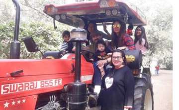 Taimur and family taking tractor ride