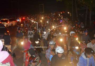 Motorists are stuck in traffic as they try to reach higher ground amid fears of a tsunami, following an earthquake in Cilacap, Central Java, Indonesia on Saturday.