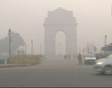 Delhi remained under dense fog as cold wave continued to create chill in the city.