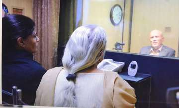 Kulbhushan Jadhav's wife and mother meet him while seated across a glass partition at Pakistan FO in Islamabad on Monday