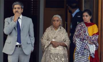 The wife, right, and mother, center, of imprisoned Indian naval officer Kulbhushan Jadhav are escorted by an Indian diplomat