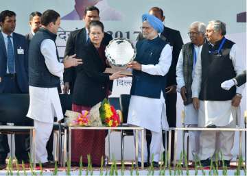 Rahul Gandhi, Sonia Gandhi and Manmohan Singh at Congress headquarters in New Delhi.