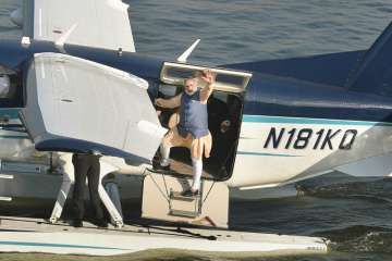 PM Modi waves to the crowd as he returns from Dharoi Dam in Mehsana district to Sabarmati riverfront by the sea-plane.