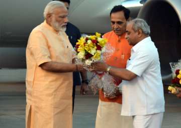 File pic - PM Modi being welcomed in Surat by Gujarat CM Vijay Rupani and Deputy CM Nitin Patel