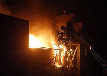 Rescue team carry out operation after a fire broke out in Mumbai