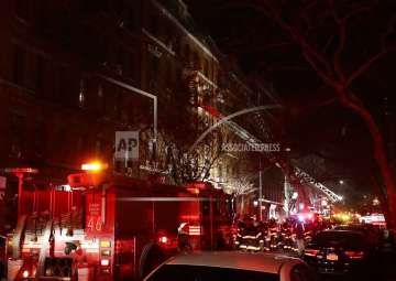 Firefighters respond to a building fire in the Bronx borough of New York. 