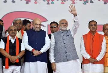 Rupani and his cabinet wore-in in presence of PM Modi and Amit Shah earlier today