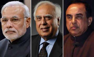 Left to right - PM Narendra Modi, Kapil Sibal and Subramanian Swamy. 