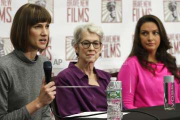 Rachel Crooks, left, Jessica Leeds, center, and Samantha Holvey attend a news conference, Monday, Dec. 11, 2017, in New York to discuss their accusations of sexual misconduct against Donald Trump. 