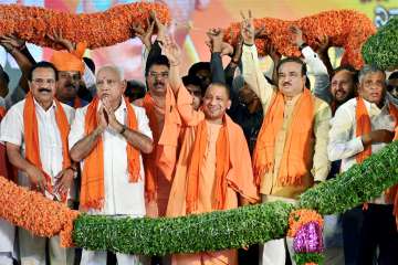 Bengaluru : UP Chief Minister Yogi Adityanath, BJP State Unit President B S Yeddyurappa, Union ministers Ananth Kumar, Sadananda Gowda, Prakash Javdekar and other state leaders wave to supporters, during the BJP's Parivartan Rally in Bengaluru on Sunday. 