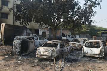 Charred vehicles following the violence during celebrations of 200th anniversary of the Battle of Bhima Koregaon, near Pune on Tuesday. 