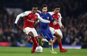 A file image of Danny Welbeck of Arsenal dribbling past Chelsea's Fabregas.