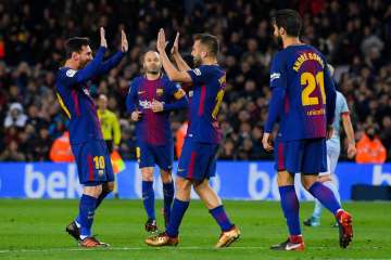 A file image of FC Barcelona players celebrating after scoring in a match.