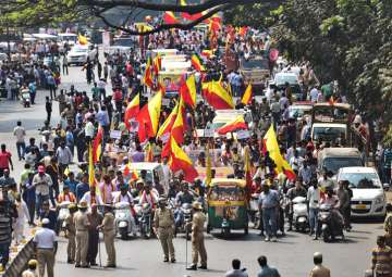 Kannada activists take out a protest rally during Karnataka Bandh in Bengaluru on Thursday
