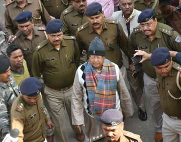 Bihar's former chief minister Lalu Yadav escorted by police officials to be produced before the special CBI court in Ranchi.