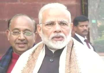 PM Narendra Modi speaks to reporters outside Parliament 