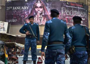 Security personnel guard outside a cinema house after release of the film Padmaavat in the walled city of Delhi on Thursday