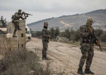 Turkey-backed Free Syrian Army fighters secure an area where Turkish army’s Operation Olive Branch continue in Azaz, northwestern Syria, on Wednesday