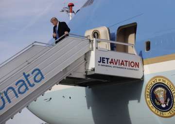Donald Trump steps off Air Force One on arrival at Zurich International Airport for the World Economic Forum