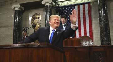 President Donald Trump arrives to deliver his first State of the Union Address to a joint session of Congress in the House chamber of the U.S. Capitol Tuesday, Jan. 30, 2018 in Washington. (Win McNamee/Pool via AP)