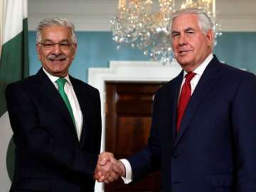 File photo of US Secretary of State Rex Tillerson R shaking hands with Pakistan Foreign Minister Khawaja Asif