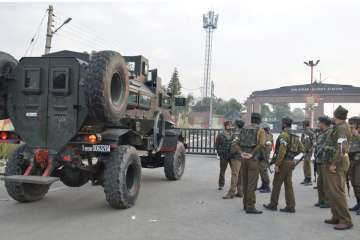 Security personnel stand guard outside the Sunjuwan Army camp during the encounter in Jammu on Saturday.