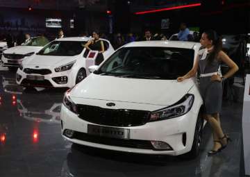 Models showcase Kia Cerato at Auto Expo 2018 in Greater Noida on Feb 7