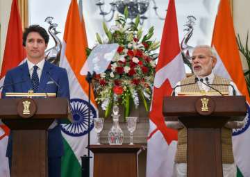 Prime Minister Narendra Modi speaks as his Canadian counterpart Justin Trudeau looks on, during their joint press conference at Hyderabad House in New Delhi on Friday.