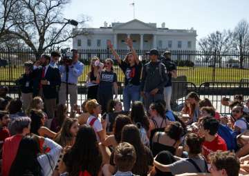 Demonstrators take part in a student protest for gun control legislation in front of the White House, Wednesday, Feb. 21, 2018, in Washington