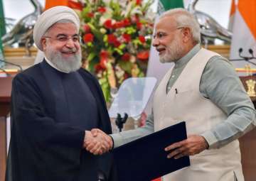 PM Narendra Modi with Iranian President Hassan Rouhani at the release of a postal stamp commemorating growing economic and trade ties between India and Iran, at Hyderabad House in New Delhi on Saturday.