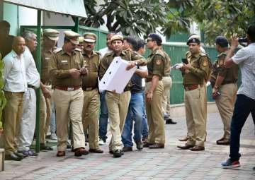 Police personnel outside CM Kejriwal's residence during an investigation in relation to the alleged assault on Chief Secretary Anshu Prakash by Aam Aadmi Party MLAs, in New Delhi on Friday.