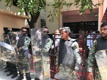 Maldives military armed with shields and batons blocked off parliament