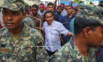 Maldivian president Yameen Abdul Gayoom, center, surrounded by his body guards arrives to address his supporters in Male, Maldives on Saturday, February 3, 2018. 