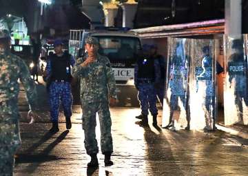 File - Maldives defence soldiers patrol on the main street of Male, Maldives, Monday, Feb. 5, 2018.
