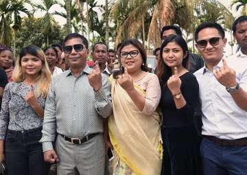 Meghalaya CM Mukul Sangma and his family members show their fingers marked with indelible ink after casting vote during Meghalaya Assembly elections, in Garo Hills on Tuesday