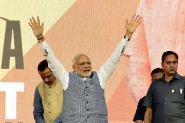 Prime Minister Narendra Modi waves to the crowd during “RUN FOR NEW INDIA MARATHON.” in Surat on Sunday.