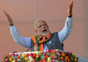 Prime Minister Narendra Modi addresses an election campaign rally for upcoming Assembly polls, in Agartala on Thursday