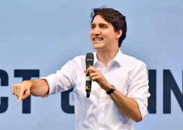 Canadian Prime Minister Justin Trudeau gestures as he speaks at the United Nations Young Changemakers Conclave, in New Delhi on Saturday.