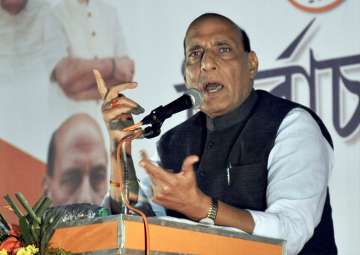 Home Minister Rajnath Singh addresses a gathering during the Tripura assembly election campaign at Agartala on Saturday.