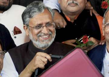 Bihar Dy Chief Minister Shushil Kumar Modi arrives to present the state budget 2018-19 in the state Assembly in Patna on Tuesday.