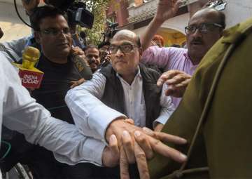  Rotomac Pens owner Vikram Kothari exits after being presented in a court in Lucknow on Saturday. 