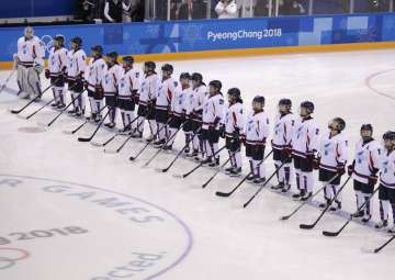 Players from the combined Koreas line up before the preliminary round of the women's hockey game against Switzerland at the 2018 Winter Olympics in Gangneung