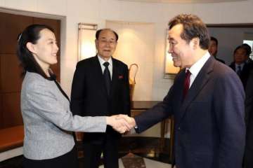 South Korean Prime Minister Lee Nak Yon (right) shakes hands with North Korean leader Kim Jong Un's sister 