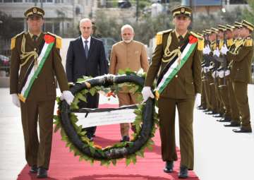 PM Narendra Modi walks to lay wreath at Mausoleum of Late President Yasser Arafat in Ramallah on Saturday.