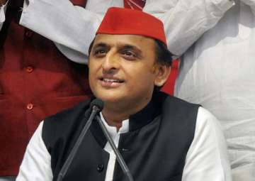 SP chief Akhilesh Yadav addresses a press conference at party headquarters in Lucknow on Thursday.