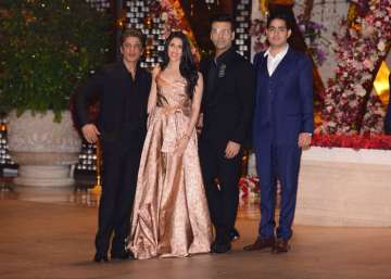 Shah Rukh Khan and Karan Johar pose with the soon-tobe-couple Shloka Mehta and Akash Ambani