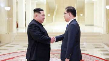 Kim Jong Un shakes hands with South Korean National Security Director Chung Eui-yong 