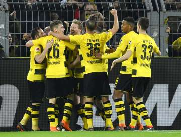 Dortmund players celebrate after scoring against Frankfurt