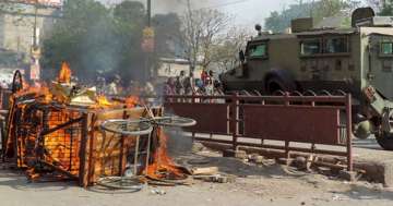 A cart set ablaze in violent clashes between two groups during a Ram Navami procession in Aurangabad district on Monday