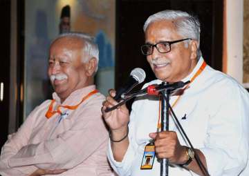 RSS general secretary Suresh 'Bhaiyyaji' Joshi speaks after being re-elected for his fourth term, in Nagpur on Saturday. Also seen is RSS chief Mohan Bhagwat.